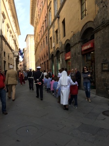 Cute scene of school children being led by nuns near policemen on our way to del Campo